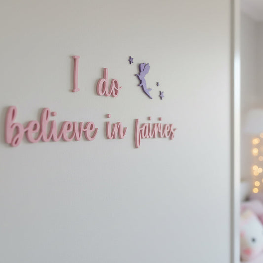 Wall with text 'I do believe in fairies' and a fairy silhouette.