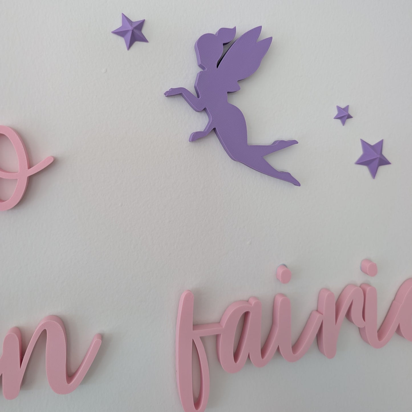 Purple fairy silhouette with pink text on a light gray background