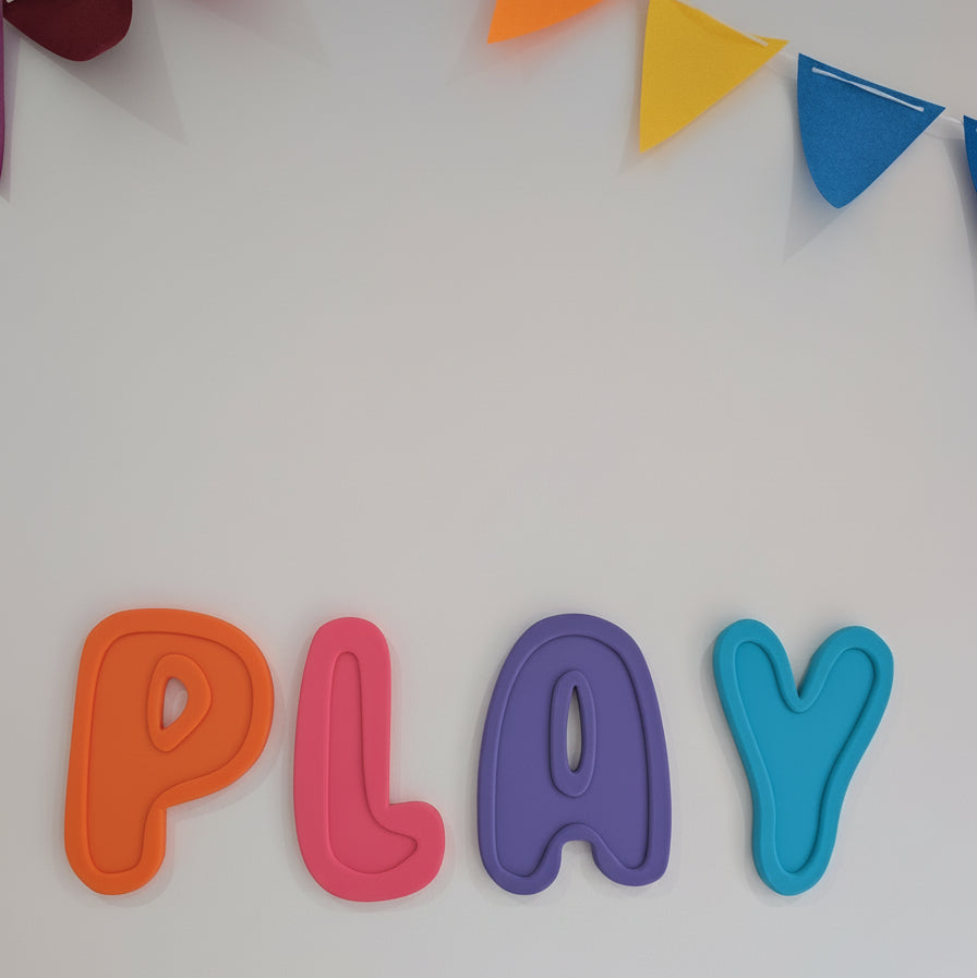 Colorful 'PLAY' letters with a banner on a white background