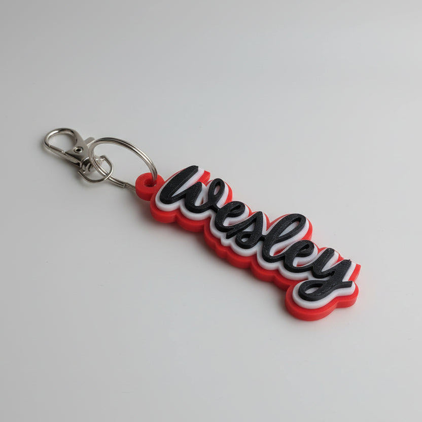 Keychain with 'Wesley' text on a light gray background