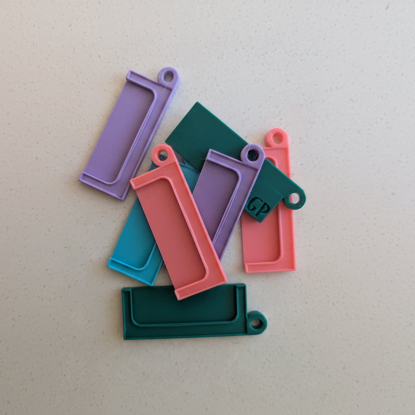 colourful yoto card holders laid on a white background